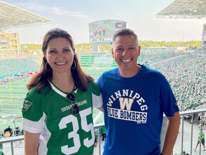 Mayor Masters (left) wearing a Saskatchewan Roughriders Jersey with Mayor of Winnipeg Manitoba Brian Bowman (right) wearing a Winnipeg Blue Bombers shirt at the Labour Day Classic game in Regina, Saskatchewan on September 4, 2022. Photo provided by the City of Regina