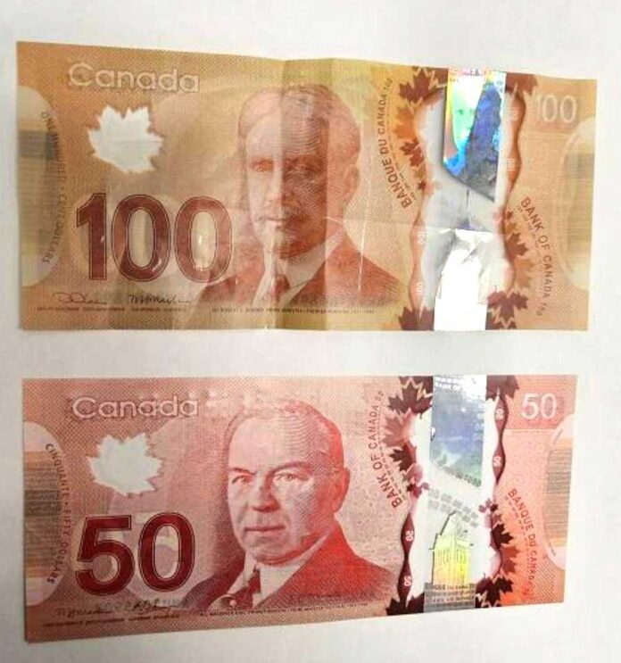 100-50-counterfeit-bill 100ドル札、50ドル札の偽札。Photo from Nanaimo RCMP website